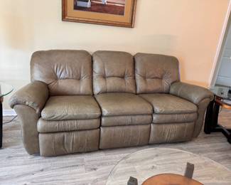 Relax in legendary La-Z-Boy comfort with this matching genuine leather reclining living room set. The collection includes a dual reclining sofa and a dual reclining loveseat, both featuring smooth manual reclining mechanisms, plush pillow-top arms, supportive high-back cushions, and generously padded seating.