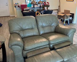 Relax in legendary La-Z-Boy comfort with this matching genuine leather reclining living room set. The collection includes a dual reclining sofa and a dual reclining loveseat, both featuring smooth manual reclining mechanisms, plush pillow-top arms, supportive high-back cushions, and generously padded seating.