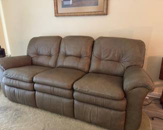 Relax in legendary La-Z-Boy comfort with this matching genuine leather reclining living room set. The collection includes a dual reclining sofa and a dual reclining loveseat, both featuring smooth manual reclining mechanisms, plush pillow-top arms, supportive high-back cushions, and generously padded seating.