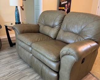 Relax in legendary La-Z-Boy comfort with this matching genuine leather reclining living room set. The collection includes a dual reclining sofa and a dual reclining loveseat, both featuring smooth manual reclining mechanisms, plush pillow-top arms, supportive high-back cushions, and generously padded seating.