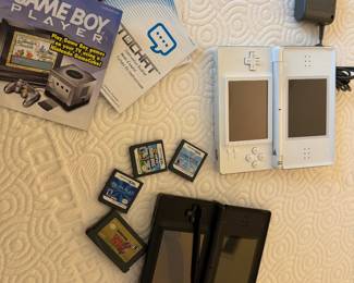A fun find for Nintendo collectors, grandkids, and retro gaming enthusiasts! This bundle includes two Nintendo DS handheld systems (white and black), charger, manuals, and several popular games. A great opportunity to introduce the grandkids to classic Nintendo gaming or add to your collection.