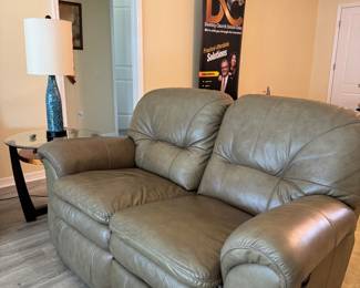 Relax in legendary La-Z-Boy comfort with this matching genuine leather reclining living room set. The collection includes a dual reclining sofa and a dual reclining loveseat, both featuring smooth manual reclining mechanisms, plush pillow-top arms, supportive high-back cushions, and generously padded seating.