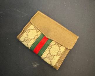Authentic Gucci GG canvas card holder wallet featuring the iconic GG monogram with the signature green and red web stripe. * Authentic Gucci * GG canvas with leather trim * Compact size for cards and folded cash * Made in Italy * Pre-owned in good condition * Clean and ready to use