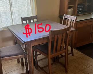 The ends of this antique table come out with to make it longer. 