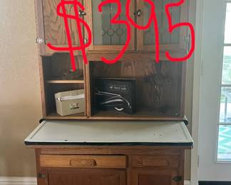 This was refurbished- the small cabinet on top has a shelf and the cabinets below do also. 