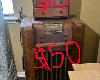 This antique radio actually was refurbished as a podium. It opens up to show two shelves on the inside. 