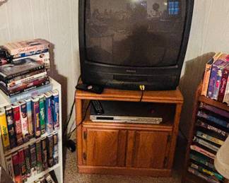 Working TV with built-in VCR, lots of VHS movies. Also DVD player and movies.