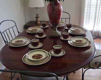 Wood and iron dining room table set with vintage ironstone. Pattern of ironstone is Wentwoth Phoenix