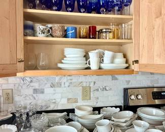Mugs, blue glass goblets, serving dishes
