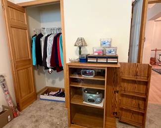 Media cabinet, cd player, alarm clock, cassette tapes, cds, lamp