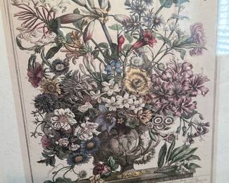 Framed Botanical Floral Print — Large framed botanical floral print featuring a detailed vase of mixed flowers in soft muted colors. The piece is matted and set in a gold-tone frame, photographed in a bathroom which suggests previous display in a home interior. Overall good condition with slight wear to the frame edges and light surface aging on the print consistent with age; glazing appears intact. Ready to hang and suitable for living room, hallway, or bathroom decor.
