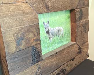 Bulky Farmhouse Wood Picture Frame — Handmade-looking bulky farmhouse picture frame in stained reclaimed-style wood with wide moulding and a small central photo opening. The heavy plank construction and visible knots/grain give a rustic, country look ideal for casual or cabin décor. Frame shows normal surface wear and darker stain accents consistent with a distressed finish; backing and hanging hardware not visible in photos. Overall substantial piece suitable for a 4x6 or similar small print display.