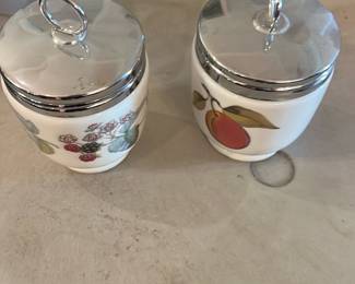 Royal Worcester Egg Coddler — Pair of Royal Winton (Grimwades) small jam or preserve jars with chrome-plated lids and ring pulls, each decorated with different fruit transfer patterns (blackberries and peach). Marked on the base with the Royal Winton / Grimwades backstamp shown in photos; good usable condition with minor surface wear and light rim discoloration consistent with age. Useful for kitchen display or serving preserves; lids appear intact though chrome shows light wear.