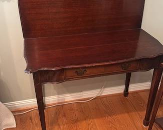 This is a Niagara Furniture mahogany gam — This is a Niagara Furniture mahogany game table featuring a flip-top design and Chippendale style.