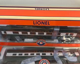 Lionel Southern Streamliner 1:87 Coach — Lionel Southern Streamliner coach model (item 6-25128) in original orange box with clear display window. Die-cast trucks, opening doors and a detailed illuminated interior are listed on the box; car appears boxed and unused though boxes show light shelf wear. A fine addition for HO/O scale Lionel collectors or layout display — preserved in original packaging with visible model number on the label.