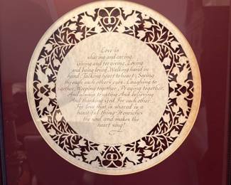 Helen Steiner Rice Framed Poem — Framed round-print poem by Helen Steiner Rice matted in burgundy with a dark carved wood frame and glass. The decorative circular design surrounds a printed sentimental poem about love; the artist/author credit "Helen Steiner Rice" is visible at the bottom. Frame shows light surface wear and small scuffs consistent with normal display; glass intact. Overall a ready-to-hang decorative wall piece measuring approximately as listed below.