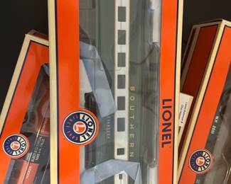 Lionel Southern Streamliner 1st Ed — Lionel Southern Streamliner diner car labeled "CHATTANOOGA" (model 6-25127) in original orange/cream box. Die-cast metal passenger/diner car with opening doors and detailed, illuminated interior as indicated on the box label; appears unopened and in original packaging with clear window. Good collectible for Lionel O gauge layouts or collectors; box shows light shelf wear but car looks intact inside. Measurements approximated from box size noted below.