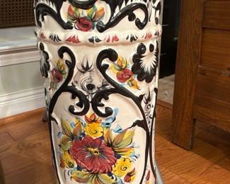 Made in Portugal Ceramic Umbrella Stand — Decorative hand-painted ceramic umbrella/umbrella stand marked "Made in Portugal 842" on the base. Tall white glazed piece with colorful floral medallions and raised black scrollwork details; scalloped rim and base add decorative interest. Good solid condition with normal surface crazing visible and no obvious large chips or repairs in photos; interior clean and usable as a stand or large planter. Measures approximately 24 inches tall and is substantial but still liftable for one or two people.