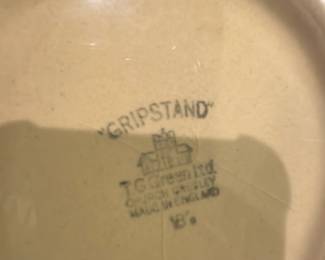 T.G. Green Ltd Gripstand Mixing Bowl — T.G. Green Ltd "Gripstand" mixing bowl in a pale yellow/tan glaze, marked on the base with the factory stamp and 'Made in England'. The heavy ceramic bowl features molded decorative panels and a broad rim with a grip pour lip; solid, hefty construction indicates durable kitchenware. T.G. Green is known for Cornishware and classic English ceramics; this piece shows light surface wear consistent with use but no visible large chips or cracks in the photos. Good functional condition for serving or display; approximate size and weight listed below.