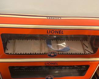 Lionel Western Pacific PS-4 Flatcar — Lionel Western Pacific PS-4 flatcar in original orange Lionel box; model number 6-27510 is printed on the box label. The sealed-looking box shows typical shelf wear to corners but the car appears complete inside with original packaging inserts. A classic O-gauge Lionel accessory suitable for layouts or collectors; box and labeling are intact and legible.