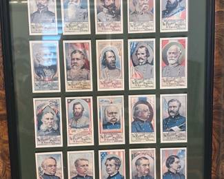 Framed Civil War Generals Print Set — Framed collection of 30 portrait prints showing Civil War-era generals and officers, matted in green with a walnut-tone frame. Each plate is reproduction-style with name banners beneath the portraits; images show light surface glare from framing but appear intact. Good decorative condition with expected age wear to frame and glass; prints appear clean with no obvious tears. A strong wall display for a history or military collection, ready to hang.