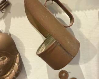 Copper Bed Warmer Pan — Solid copper bed warmer pan with a long hinged lid and a looped iron handle, the classic hearth accessory used to warm bedding. Patina and surface wear are visible across the copper body and lid consistent with age and use; hinge appears intact though slightly loose. Decorative and functional as a rustic wall display or for reenactment/period décor; lightweight for a metal piece of this size. Measures as shown below; sold as-is.