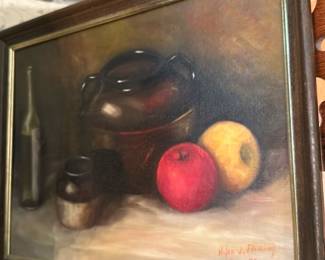 Helen J. Fleming Feb 73 Still Life — Signed still-life oil (or oil-like) painting signed by Helen J. Fleming and dated Feb 73, showing a classic arrangement of apples and pottery on a draped surface. The composition displays soft, blended brushwork and warm tonal palette typical of mid-20th-century traditional still-life studies. Framed in a simple molded wood frame with a narrow gilt liner; visible surface shows light craquelure and expected surface age but no major losses visible in photos. Overall good condition for its age; frame shows light wear at edges.