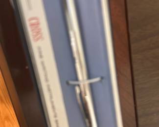 Cross Silver Ballpoint Pen — Classic Cross silver-tone ballpoint pen in its original presentation box. The Cross name is visible on the inner box card; pen appears chrome/plated with a slim profile and twist or click mechanism (refill not verified). Light handling wear visible on box edges; pen finish appears clean from photos. A reliable everyday writing instrument suitable for gift or desk use; includes the shown box.