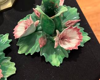 Porcelain Floral Candle Holder — Hand-painted porcelain floral toothpick or match holder molded as green leaves with pink-and-white blossoms. The piece shows bright glaze with some surface wear and small glaze chips around the central cup as pictured; stable and decorative for display. Compact accent suitable for mantel or table display; no maker's mark visible in photos.