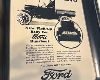 Ford Runabout Tin Serving Tray — Metal serving tray decorated with a vintage Ford Runabout advertisement headlined "ANNOUNCING" and showing an illustrated Model T pickup body and Ford script logo. The printed text and imagery are clear and the tray has a raised rim with black painted border; light surface wear and minor scuffs visible consistent with display use. Good decorative piece for automotive collectors or to complement a garage or office display; measures approximately as listed below.