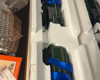Lionel Southern Berkshire 6-38607 — Lionel Southern Berkshire locomotive and tender (model 6-38607) in original styrofoam packing shown. Box label reads "Southern Berkshire Locomotive and Tender" and lists die-cast metal body, Railsounds "R" sound system and maintenance-free motor; Lionel branding on box. Locomotive and tender appear unused in insert with ribbon ties; box shows light shelf wear. Good collectible condition for display or use with compatible O-gauge layouts.
