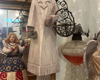 Lorando Angel Figurine — Lorando carved-style angel figurine with metal filigree wings and halo, mounted on a turned columnar plinth. A plaque on the base reads "LORANDO" with an additional sticker giving manufacture details; finish is a distressed whitewash over simulated carved wood. Good decorative condition with light surface wear consistent with display; no obvious chips or breaks noted in the photos. Stands tall and would suit a mantel or sunroom display.