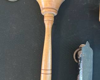 Wooden Mallet / Rattle Handle — Solid turned-wood hand tool that appears to be a small mallet or vintage rattle-style handle with a rounded head and tapered grip. The piece is smoothly turned with two decorative rings near the lower shaft and a small knob finial; light surface wear and patina consistent with age are visible but no major damage. Useful for craftwork, light shop use, prop or decorative display; vintage, unbranded and hand-turned construction. Sold as shown — exact provenance unknown.