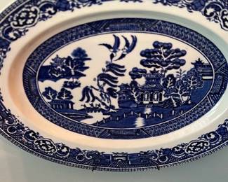 Spode Blue Italian Dinner Plate — Spode Blue Italian pattern dinner plate with classic cobalt transferware decoration. The plate displays the central Italianate scene and intricate border typical of Spode's Blue Italian line; maker's mark on the back reads "Spode" and notes "Blue Italian". Plate appears in good collectible condition with normal surface wear and no visible chips or cracks in the photos; a hanging wire is attached to the rim. Useful as a display piece or serviceware; please review photos for exact condition and size.