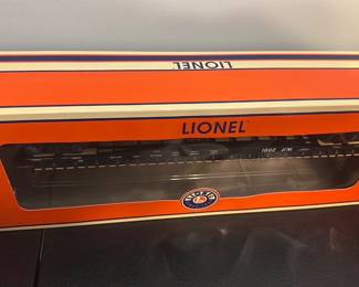 Lionel Union Pacific PS-4 Flatcar — Lionel Union Pacific PS-4 flatcar in original orange window box, model number 6-27510 as shown on the packaging. Boxed die-cast metal model with metal wheels and realistic detailing visible through the display window; collectible for model railroaders or Lionel collectors. Box shows light shelf wear but appears intact; car condition looks new/unused inside the sealed box from photos. Compact boxed collectible that fits standard O gauge layouts.