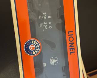 Lionel Baltimore & Ohio Hopper — Lionel Baltimore & Ohio hopper car in original Lionel window box, clearly labeled B & O and item details on the packaging. Ready-for-collector display or to add to an O gauge freight set; box shows light shelf wear but appears intact and the car looks unused inside. Lionel is known for durable O-gauge rolling stock and this piece is suitable for hobbyists and model train layouts. Condition: box shows minor wear; car presumed excellent as still in original packaging.