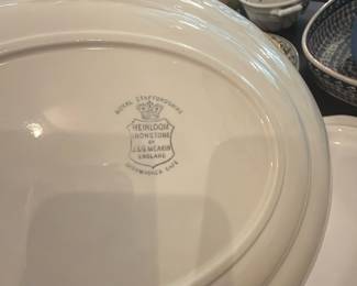 Royal Staffordshire Heirloom Ironstone — Royal Staffordshire Heirloom ironstone dinnerware piece stamped "J & G Meakin England" shown here — a classic heavy white ironstone bowl/charger with a simple molded rim. Meakin produced durable transfer and plain ironstone popular for everyday dining; this piece is sturdy with glazed finish and dishwasher-safe marking visible on the backstamp. Photos show overall good condition with light surface wear and no obvious chips or cracks; sold as a single ceramic serving piece. Measurements are approximate; see dimensions for size.