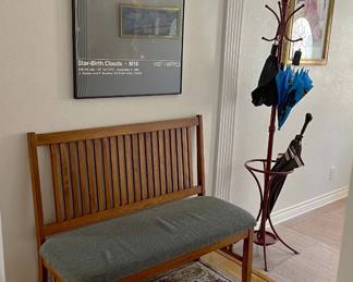 There are a few pieces of framed art in the sale, along with a hat & coat rack.  And let's not forget the cushioned bench.