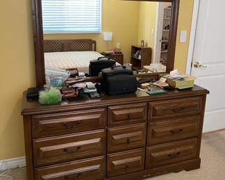 In the same room is this mirrored dresser.  There is also the camera bag (does it contain a camera?) and other smaller items.