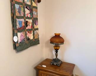 quilts, night stand, lamp