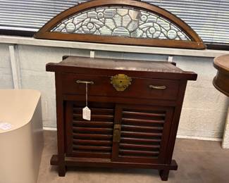 Merchants small chest. Above in window sill is beautiful beveled leaded glass arch. perfect condition.