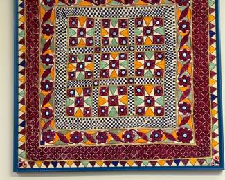Vintage Gujarati textile wall hanging features intricate mirror, work and embroidery.