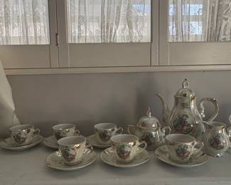 Vintage Japanese Porcelain Tea Set with Courting Couple Scene and Gilded Trim fourth image