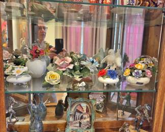 Assortment of Hummel, Lladro, Royal Coppenhagen, Sterling etc.