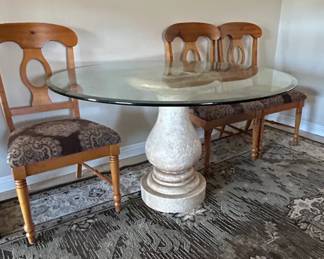 Round Glass Top Dining Table with Pedestal Base and Upholstered Chairs