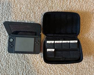 Nintendo 3DS XL with case and games