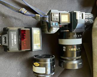 V110 - $60. Minolta 700 Camera, 35-100 Lens, 50 Lens and Accessories. Untested