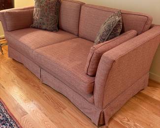 V68 - $175. Custom Upholstered Sofa in excellent condition. Pinkish/ Red Color. Measures 72” Wide x 34” Deep x Floor to seat 18” x Floor to back 26” Tall
