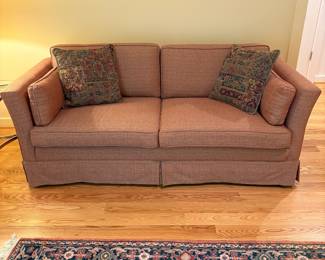 V68 - $175. Custom Upholstered Sofa in excellent condition. Pinkish/ Red Color. Measures 72” Wide x 34” Deep x Floor to seat 18” x Floor to back 26” Tall