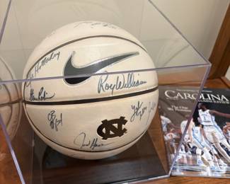 V104 - $250. 2010-2011 Season UNC Signed Basket Ball in Display Case. Signed by Players and Coaches.